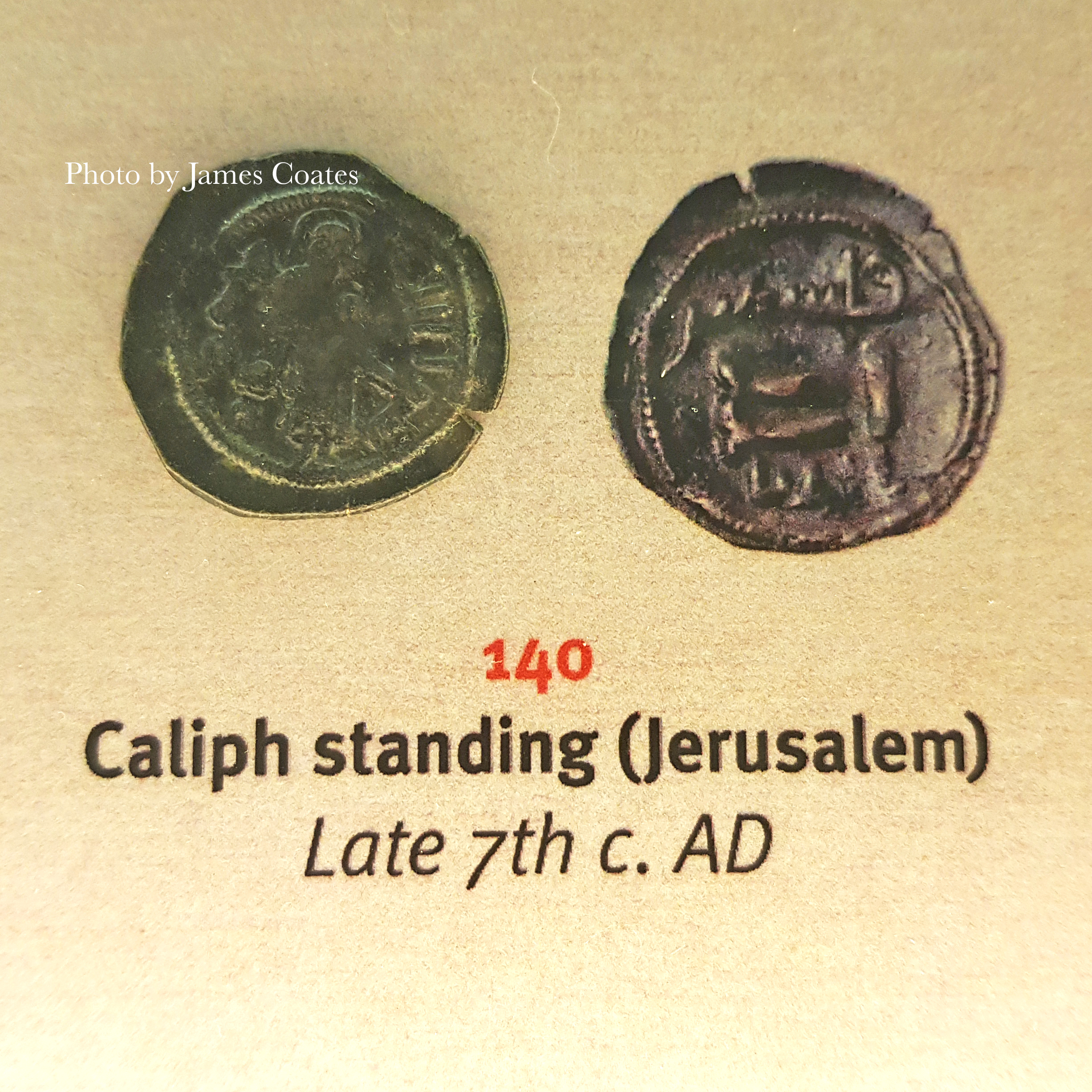 Two early Islamic coins showing a standing caliph figure, late seventh century, photographed by the author