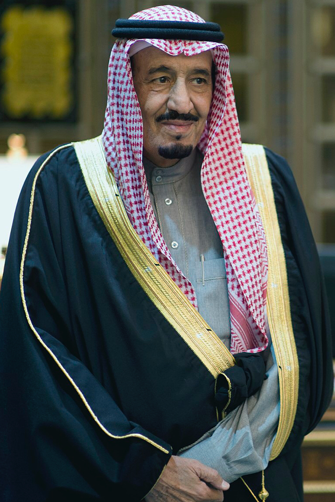 King Salman bin Abdulaziz Al Saud of Saudi Arabia, seated, in formal dress