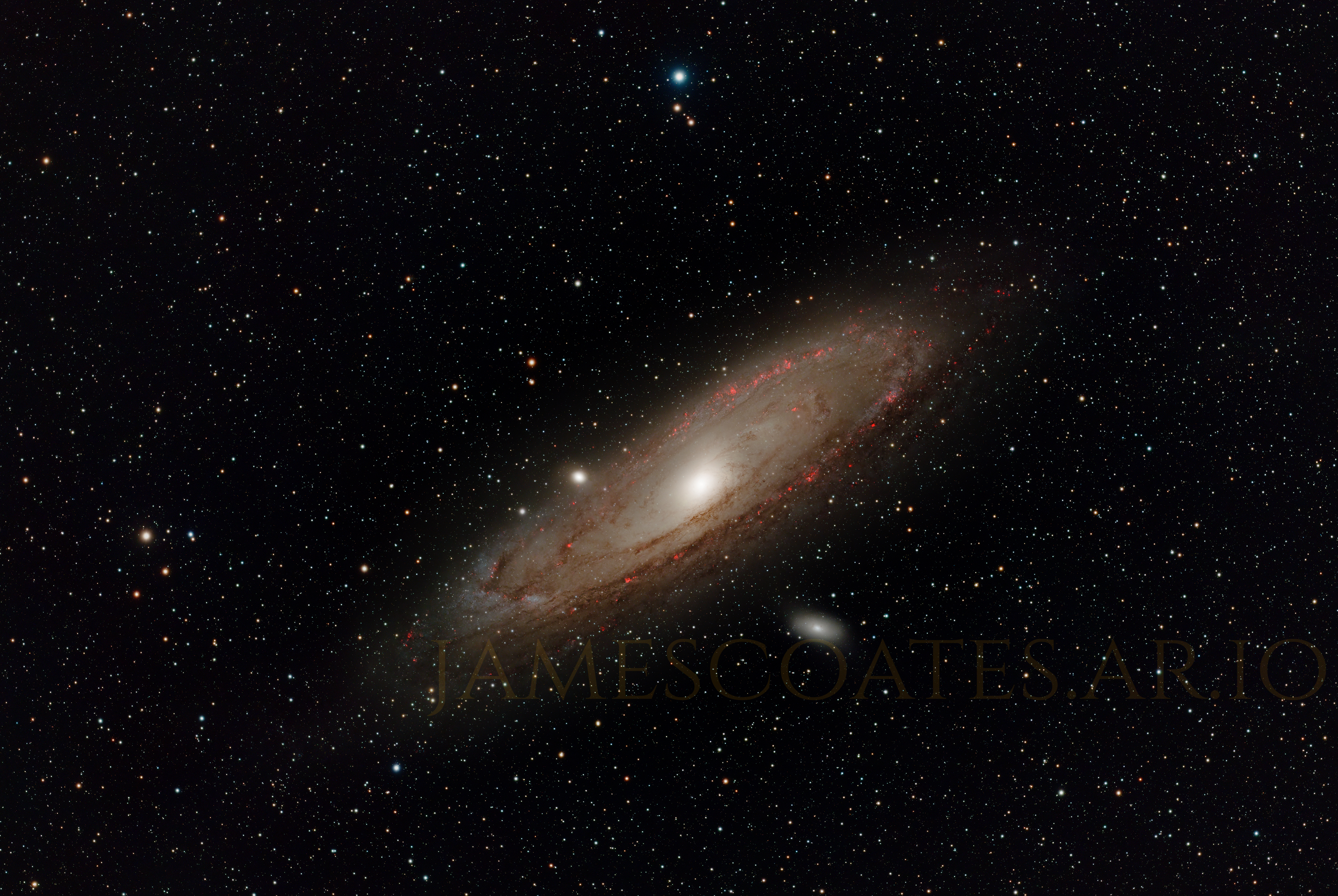 The Andromeda Galaxy, a large spiral seen at an oblique angle with dust lanes across its arms