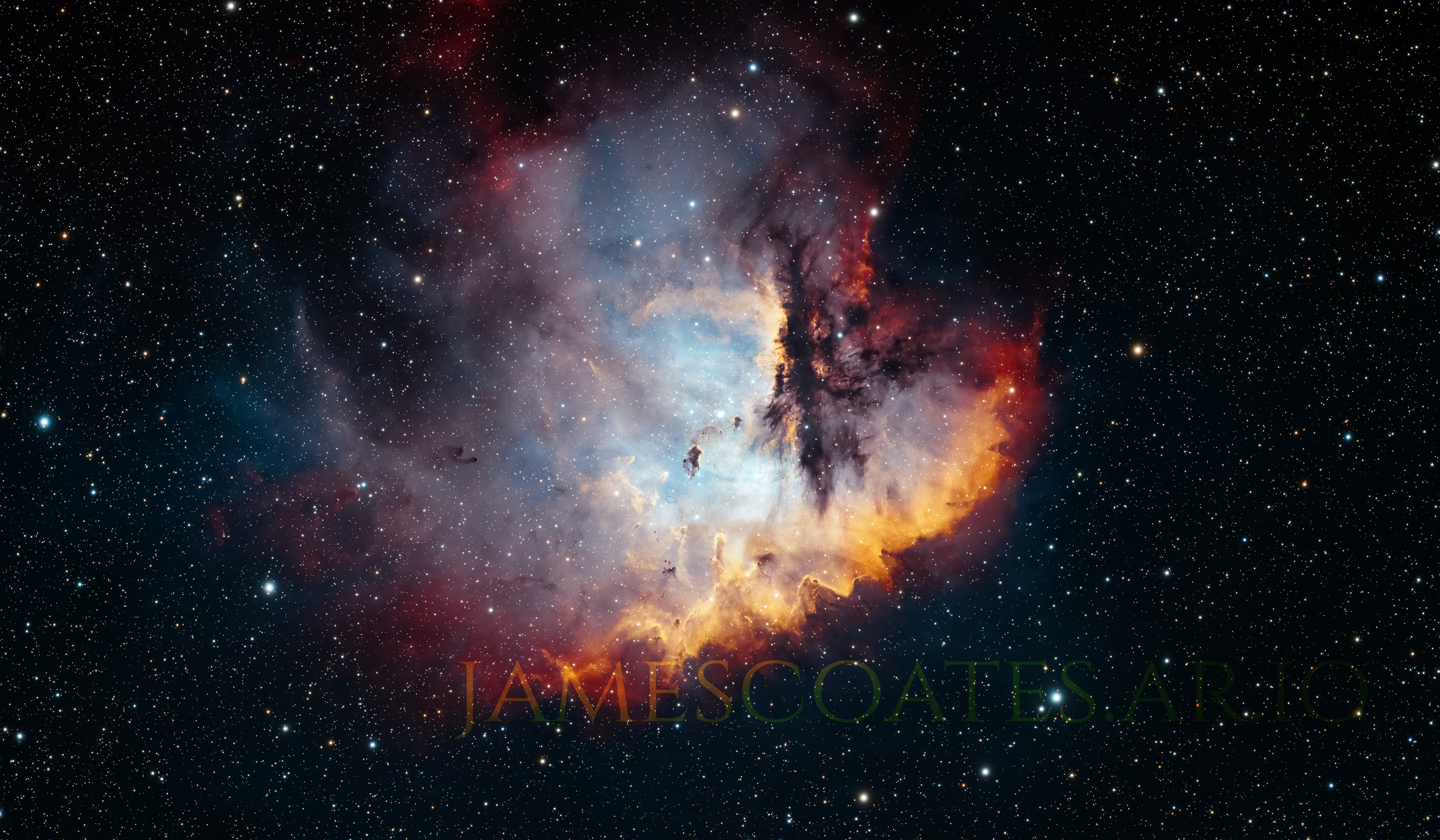 The Pacman Nebula in Cassiopeia, an emission nebula with dark Bok globules across its face, imaged in narrowband